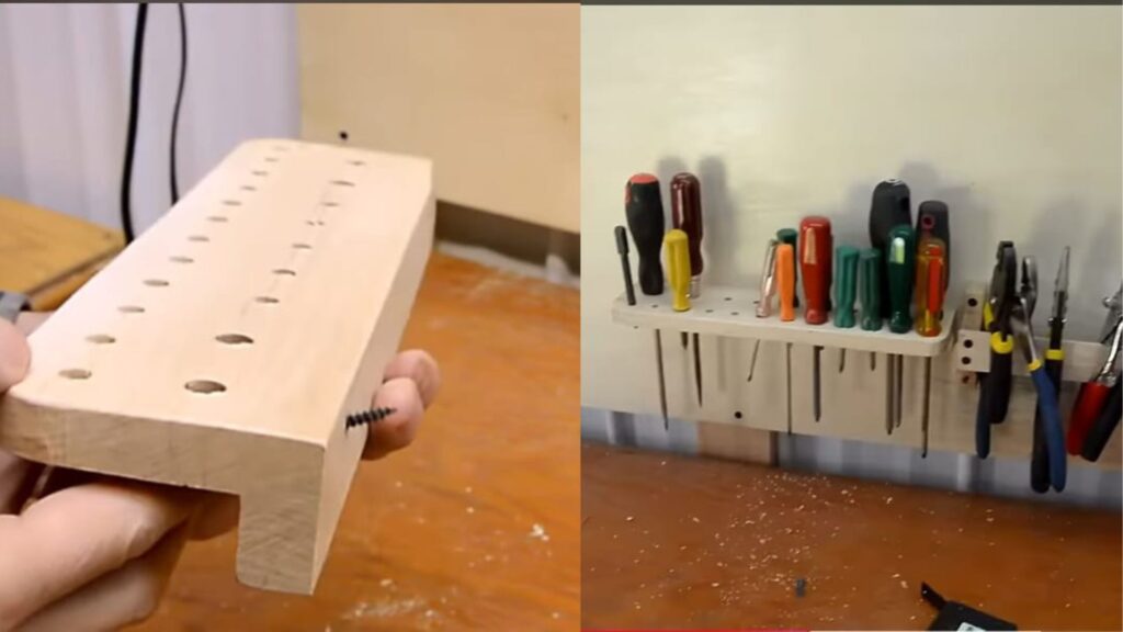 Suporte de madeira com furos verticais, fixado na parede, organizando chaves de fenda de diferentes cores e tamanhos.